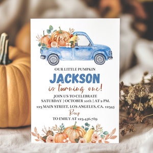 May include: A rectangular birthday invitation card featuring a watercolor illustration of a blue pickup truck carrying pumpkins and flowers. The text reads: GOOBER STUDIO PRINTS, OUR LITTLE PUMPKIN JACKSON is turning one! JOIN US TO CELEBRATE SATURDAY | OCTOBER 10th | AT 2 PM. 123 MAIN STREET, LOS ANGELES, CA. 12345 RSVP TO EMILY AT 123.456.789.