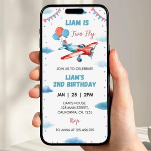 May include: A blue and red airplane with a red propeller flies through the clouds. The text "Liam is Two Fly" is at the top of the invitation. The invitation is for Liam's 2nd birthday party on January 25th at 2pm. The address is 123 Main Street, California, CA 1235. RSVP to Anna at 123.456.789.