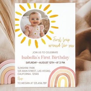 May include: A yellow sun with a photo of a baby girl inside. The text reads "First trip around the sun" and "Isabella's First Birthday". The invitation includes the date, time, location, and RSVP information.