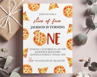 May include: A white invitation card with a pizza theme. The card has a red and orange graphic of a pizza slice with the text "slice of fun" and "Jackson is turning one". The invitation details are printed in black text and include the date, time, location, and RSVP information.