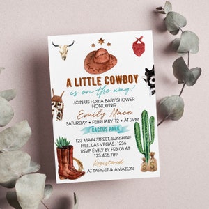 May include: A white baby shower invitation card featuring watercolor illustrations of a brown cowboy hat, a cow skull, a red bandana, a cactus, and brown leather boots. The text reads A LITTLE COWBOY is on the way! JOIN US FOR A BABY SHOWER HONORING Emily Mace SATURDAY FEBRUARY 12 AT 2PM CACTUS PARK 123 MAIN STREET, SUNSHINE HILL, LAS VEGAS. 1236 RSVP EMILY BY FEB 08 AT 123.456.789 Registered AT TARGET & AMAZON.