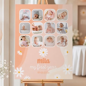 May include: A peach-colored sign on a wooden easel, featuring a collage of baby photos in square frames. The sign includes the text "mila my first year" with a daisy graphic and the date 09.03.202x.