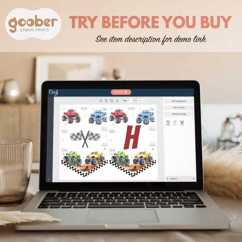 May include: A laptop screen displaying a digital design template for a birthday banner featuring a large red letter "H" and a checkered flag with monster trucks in blue, red, green, and yellow. The design is on a white background.
