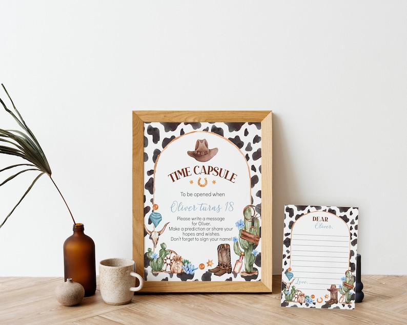 May include: A printable time capsule sign with a cowboy theme. The sign has a brown cowboy hat, a horseshoe, and a cactus. The text on the sign reads "Time Capsule To be opened when Oliver turns 18. Please write a message for Oliver. Make a prediction or share your hopes and wishes. Don't forget to sign your name!"