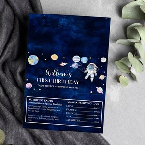 May include: A blue and white first birthday invitation with a watercolor galaxy background. The invitation features a cartoon astronaut holding balloons and the text "William's First Birthday".