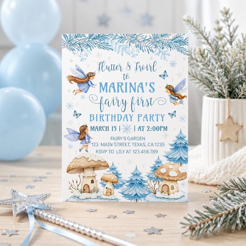 May include: A fairy-themed birthday party invitation with blue and white watercolor illustrations. The invitation includes the text "Flutter & Twirl to Marina's Fairy First Birthday Party" with event details. A silver wand and blue balloons are in the background.