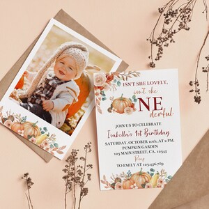 May include: A birthday invitation card and a photo print featuring a child, both decorated with watercolour pumpkins, flowers, and foliage. The text reads: ISN'T SHE LOVELY, isn't she ONEderful, JOIN US TO CELEBRATE Isabella's 1st Birthday, SATURDAY, OCTOBER 10th, AT 2 PM, PUMPKIN GARDEN, 123 MAIN STREET, CA. 12345, RSVP TO EMILY AT 123.456.789.