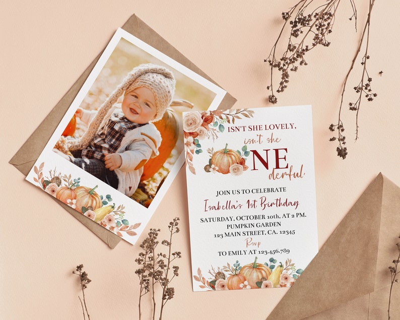 May include: A birthday invitation card and a photo print featuring a child, both decorated with watercolour pumpkins, flowers, and foliage. The text reads: ISN'T SHE LOVELY, isn't she ONEderful, JOIN US TO CELEBRATE Isabella's 1st Birthday, SATURDAY, OCTOBER 10th, AT 2 PM, PUMPKIN GARDEN, 123 MAIN STREET, CA. 12345, RSVP TO EMILY AT 123.456.789.