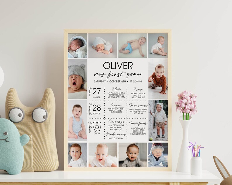 May include: A rectangular wooden-framed poster titled Oliver My First Year, featuring twelve photographs of a baby. The text includes birth details, milestones, favorite songs, foods, and toys, with measurements of 27 inches and 28 pounds.