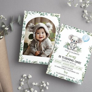 May include: Two rectangular birthday invitation cards featuring a watercolor eucalyptus leaf border. One card displays a photo of a baby in a koala hood. The other card features a koala illustration, a blue balloon with the number one, and text.