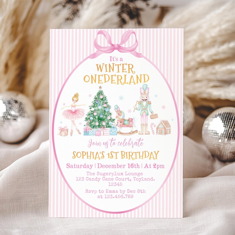 May include: A rectangular invitation card with a pink and white striped background featuring a pink bow at the top. The text reads It's a WINTER ONEDERLAND, Join us to celebrate SOPHIA'S 1ST BIRTHDAY, Saturday December 16th at 2pm, The Sugarplum Lounge, 123 Candy Cane Court, Toyland, 12345, Rsvp to Emma by Dec 8th at 123.456.789. Illustrations include a ballerina, Christmas tree, rocking horse, nutcracker, and gingerbread house.