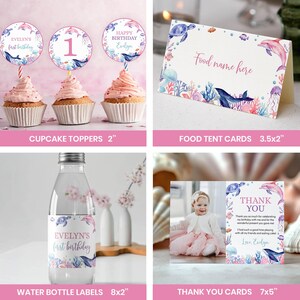 May include: A collection of birthday party supplies featuring an ocean theme with dolphins, turtles, and coral illustrations. Includes three 2-inch cupcake toppers, a 3.5x2-inch food tent card, 8x2-inch water bottle labels, and a 7x5-inch thank you card.