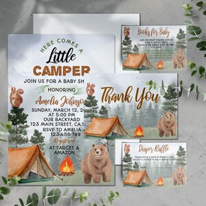 May include: A baby shower invitation with a woodland theme. The invitation features a watercolor illustration of a tent, a campfire, a bear, and a squirrel. The text on the invitation reads "Here comes a little camper" and "Join us for a baby shower honoring Amelia Johnson".