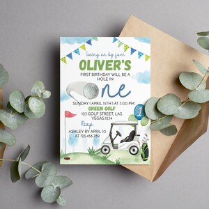 May include: A blue and green golf-themed first birthday party invitation with a golf cart, golf balls, and the text "Swing on by for Oliver's First Birthday Will Be A Hole In One. Sunday I April 15th I At 3:00 PM Green Golf 123 Golf Street, Las Vegas. 1234 RSVP Ashley By April 10 At 123.456.789"