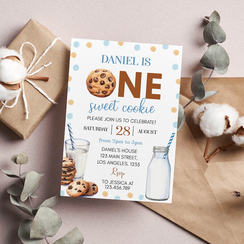 May include: A birthday invitation with the text "DANIEL IS ONE sweet cookie." The invitation features a watercolor illustration of a chocolate chip cookie, a glass of milk, and a milk bottle with a straw. The invitation is decorated with blue and yellow polka dots.