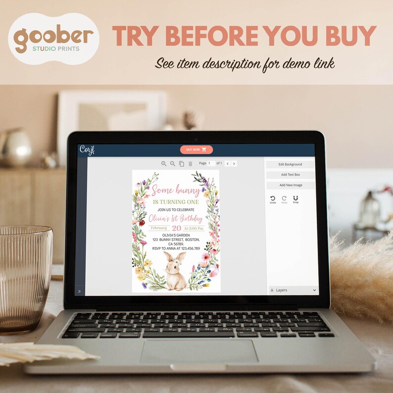May include: A laptop screen displaying a digital birthday invitation template featuring a watercolor bunny surrounded by a floral wreath. The text reads Some bunny IS TURNING ONE, Olivia's 1st Birthday, February 20, and address details.