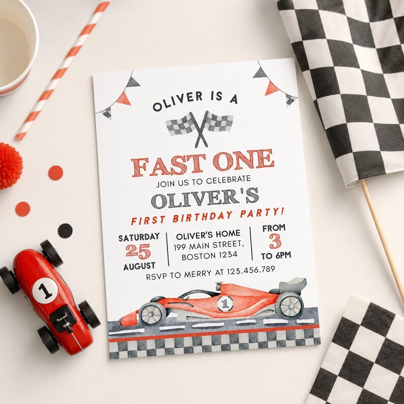 May include: A birthday party invitation with a race car theme. The invitation reads "Oliver is a Fast One" and includes details for the party. A red toy race car and checkered flags are also present.