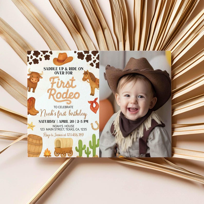 May include: A rectangular birthday invitation card featuring a western theme with cow print, a brown cowboy hat, a bull, a horse, a wagon, and cacti. The text reads: SADDLE UP & RIDE ON OVER FOR First Rodeo TO CELEBRATE Noah's first birthday.