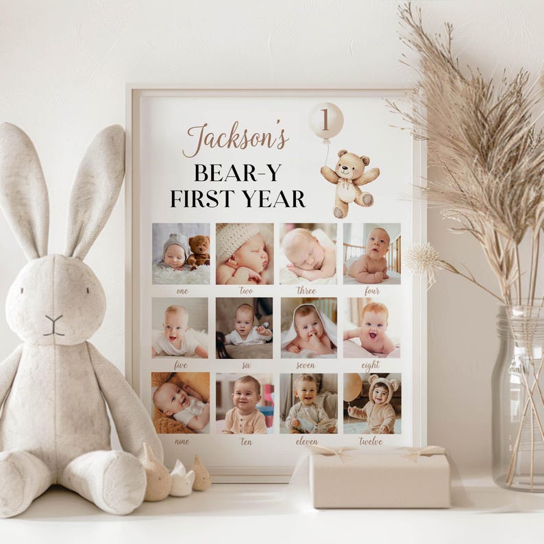 May include: A white poster featuring a brown teddy bear holding a balloon with the number 1 on it. The poster reads "Jackson's BEAR-Y FIRST YEAR" and includes a grid of 12 photos of a baby boy.