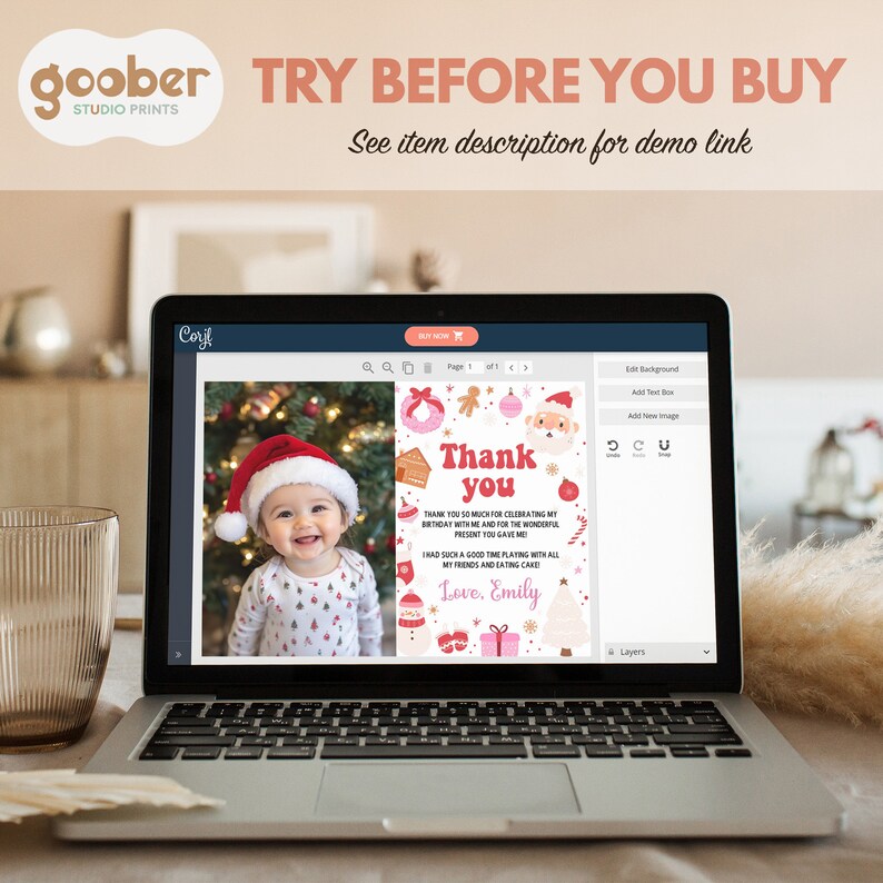 May include: A laptop screen displaying a customizable digital thank you card template with a photo of a smiling baby in a Santa hat, surrounded by Christmas-themed graphics including a gingerbread man, ornaments, and the text Thank you.