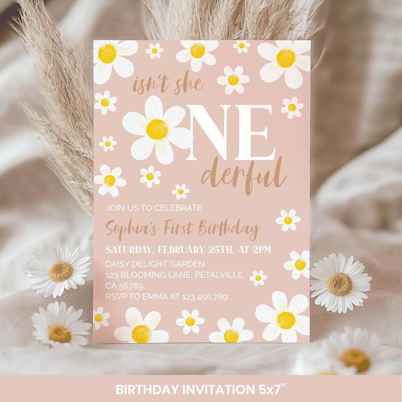 May include: A rectangular birthday invitation card with a dusty pink background featuring white daisy illustrations with yellow centers. The text reads: isn't she ONEderful, JOIN US TO CELEBRATE Sophia's First Birthday, SATURDAY, FEBRUARY 25TH, AT 2PM.