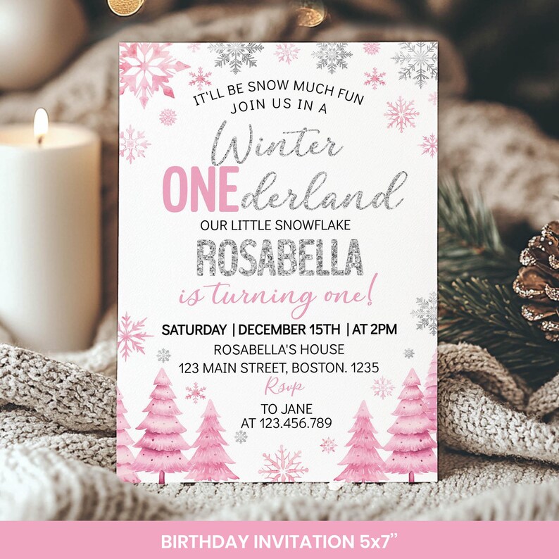 May include: A rectangular birthday invitation card featuring pink and silver snowflake illustrations, pink watercolour pine trees, and text that reads: IT'LL BE SNOW MUCH FUN JOIN US IN A Winter ONEderland OUR LITTLE SNOWFLAKE ROSABELLA is turning one!