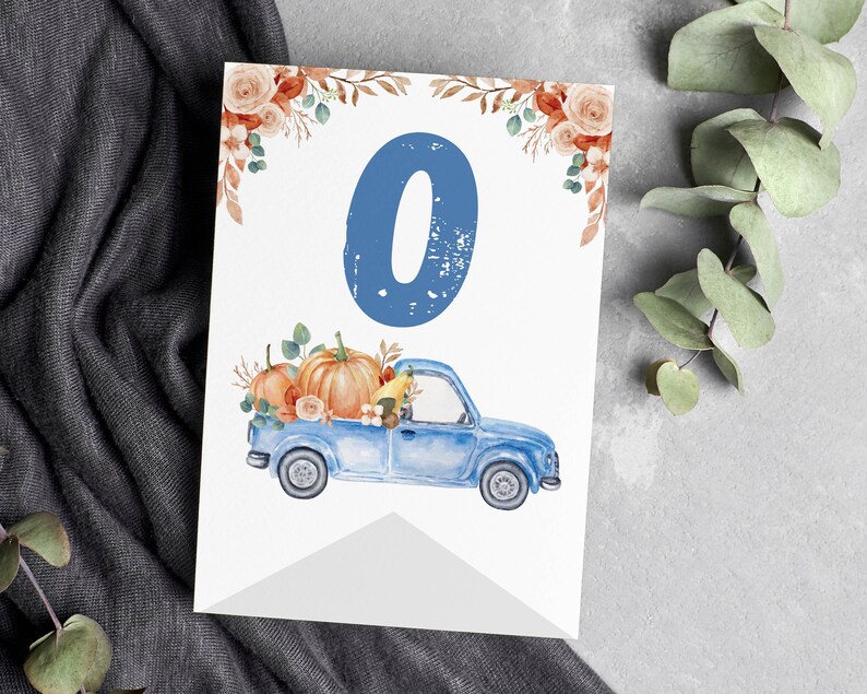 May include: A white rectangular card featuring a large blue number zero at the top, decorated with watercolour orange pumpkins and foliage in the bed of a blue pickup truck, with additional floral accents in the top corners of the card.