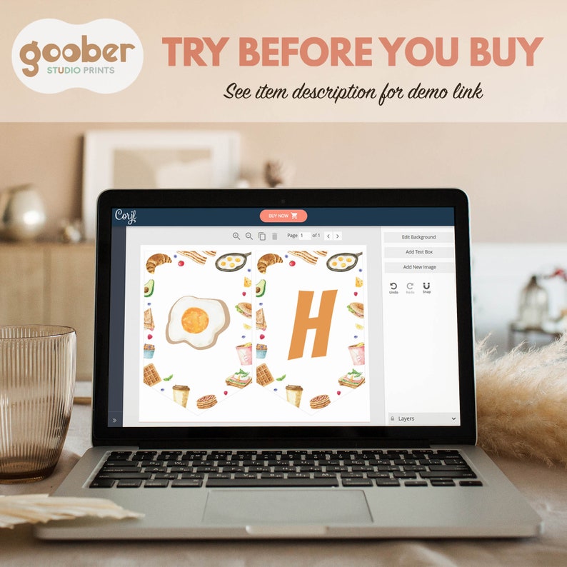 May include: A laptop screen displaying a design program with a breakfast themed banner featuring the letter "H" surrounded by images of eggs, bacon, coffee, and other breakfast foods. The text "TRY BEFORE YOU BUY" is displayed at the top of the screen.