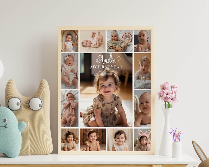 May include: A collage of photos of a baby girl, with the text "Amelia, My First Year" in the center. The photos are arranged in a grid pattern, with a wooden frame.