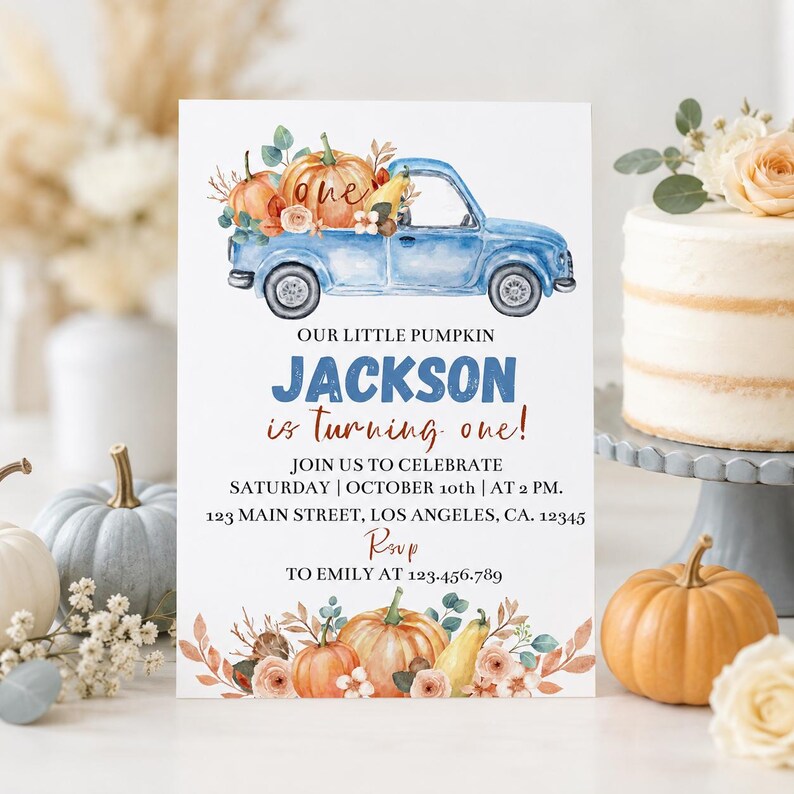 May include: A white birthday invitation card featuring a watercolor blue pickup truck carrying pumpkins and flowers. Text reads: OUR LITTLE PUMPKIN JACKSON is turning one! JOIN US TO CELEBRATE SATURDAY | OCTOBER 10th | AT 2 PM. 123 MAIN STREET, LOS ANGELES, CA. 12345 RSVP TO EMILY AT 123.456.789.