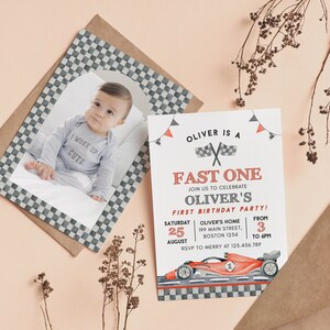 May include: A baby's first birthday party invitation with a race car theme. The invitation features a photo of the baby, a race car illustration, and the text "Oliver is a Fast One". The invitation is on a white background with red and gray accents.