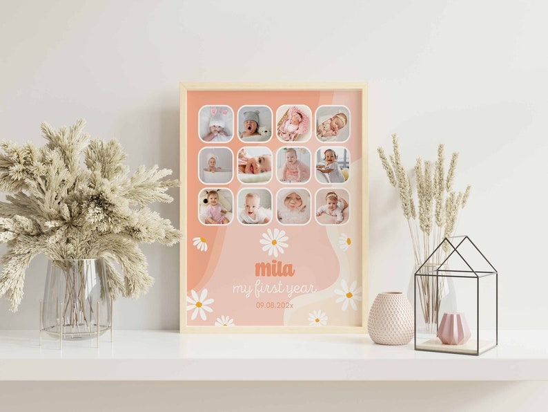 May include: A framed collage featuring twelve baby photos in a light wood frame. The background is peach and white with daisy accents. The text "mila my first year 09.08.202x" is displayed in the lower center.