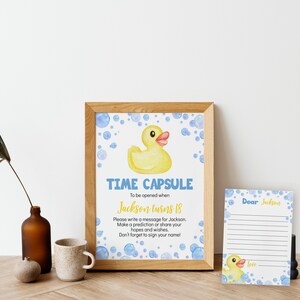 May include: A printable time capsule card with a yellow rubber ducky and blue bubbles. The card says "Time Capsule" and "To be opened when Jackson turns 18". There is a separate card with lines for writing a message to Jackson.