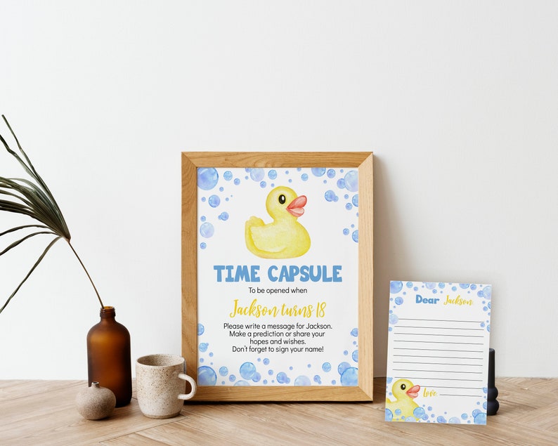 May include: A printable time capsule card with a yellow rubber ducky and blue bubbles. The card says "Time Capsule" and "To be opened when Jackson turns 18". There is a separate card with lines for writing a message to Jackson.