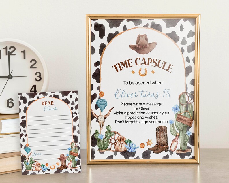 May include: A printable time capsule sign with a cowboy theme. The sign has a brown and white cow print background with a gold frame. The text on the sign reads "Time Capsule" with a horseshoe symbol and "To be opened when Oliver turns 18". There are illustrations of a cowboy hat, boots, cacti, and a skull.