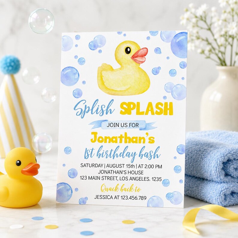 May include: A birthday invitation with a yellow rubber duck illustration and blue bubbles. The text reads "Splish Splash" and announces Jonathan's 1st birthday bash, including date, time, and location.