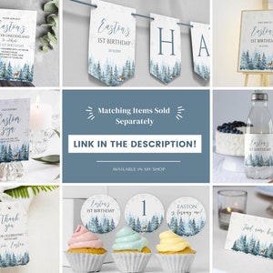 May include: A collection of winter-themed party stationery featuring a blue forest and deer illustration. Items include an invitation, banner, welcome sign, water bottle label, thank you tag, cupcake toppers, and a food tent card with snowflake accents.