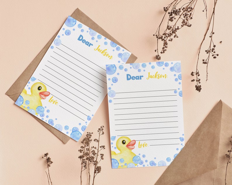 May include: Two blank stationery note cards with blue and white bubble designs and a yellow rubber duck illustration. The cards say "Dear Jackson" and "Love" at the bottom.