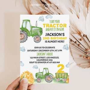 May include: A green tractor with a yellow number 2 on the side. The tractor is on a watercolor background with clouds and a sunflower. The text on the invitation reads "Start your tractor and put it in gear. Jackson's 2nd birthday is almost here! Join us to celebrate Saturday | December 12th | at 3 PM Jackson's House 123 Main Street, Los Angeles, California 1456 RSVP to Jennifer at 677.855.969".