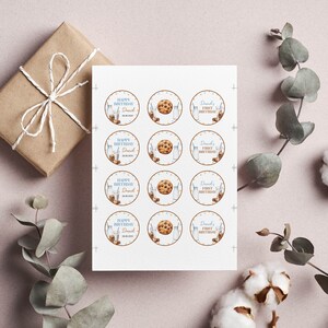 May include: A sheet of twelve circular stickers featuring three repeating designs: a glass of milk with cookies, a single chocolate chip cookie, and a milk bottle with the text "Daniel's First Birthday" and "Happy Birthday Daniel 28.08.202X".