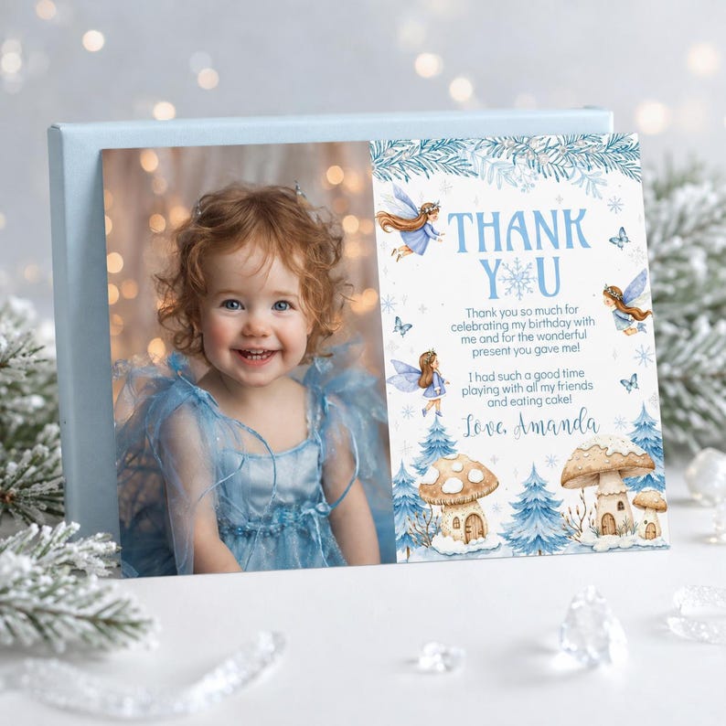 May include: A rectangular thank you card featuring a photograph of a child in a blue dress on the left and a winter-themed illustration on the right. The text reads: THANK YOU, Thank you for celebrating my birthday with me and for the wonderful present you gave me! I had such a good time playing with all my friends and eating cake! Love, Amanda.