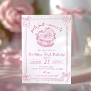 May include: A pink and white invitation card featuring a pink bow and the text "girls just wanna be one" with a pink cake illustration. The invitation is for Charlotte's First Birthday on 23rd January from 2 PM to 5 PM at Pink Bow Lane, 123 Main Street, Las Vegas, CA 1235. RSVP to Camelia at 123.456.789.