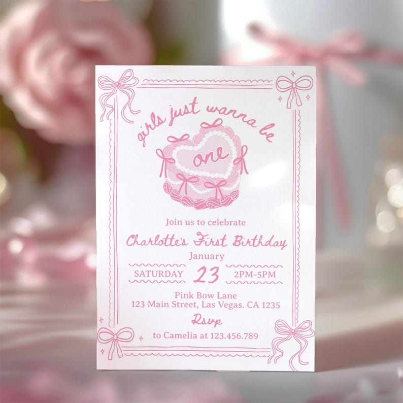 May include: A pink and white invitation card featuring a pink bow and the text "girls just wanna be one" with a pink cake illustration. The invitation is for Charlotte's First Birthday on 23rd January from 2 PM to 5 PM at Pink Bow Lane, 123 Main Street, Las Vegas, CA 1235. RSVP to Camelia at 123.456.789.