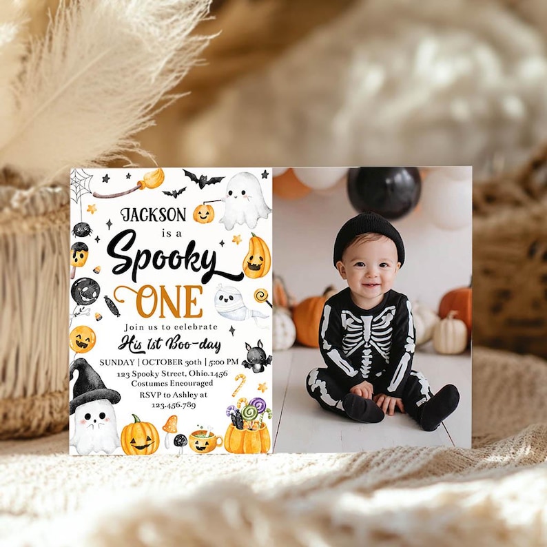 May include: A Halloween-themed invitation with the text "Jackson is a Spooky One" and a photo of a baby in a skeleton costume. The invitation includes details for a first birthday party, with pumpkins and ghosts.