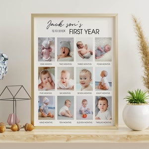 May include: A gold-framed poster with a white background featuring a baby's first year photo collage. The poster has the text "Jack son's 12.10.202X FIRST YEAR" at the top and twelve photos of a baby at different ages, each labeled with the corresponding month.
