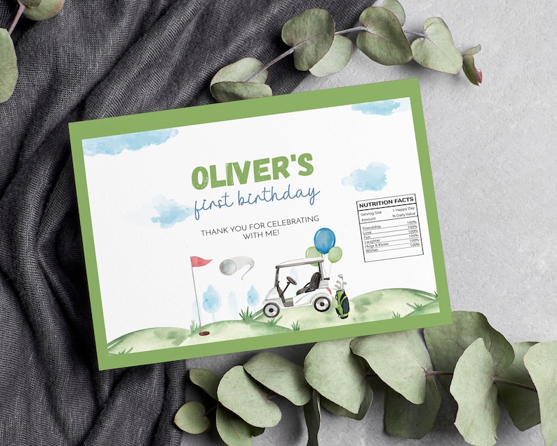 May include: A green-bordered invitation with the text "Oliver's first birthday" and a golf theme. The design includes a golf cart, a flag, and a golf ball. The invitation also has a "Nutrition Facts" section.