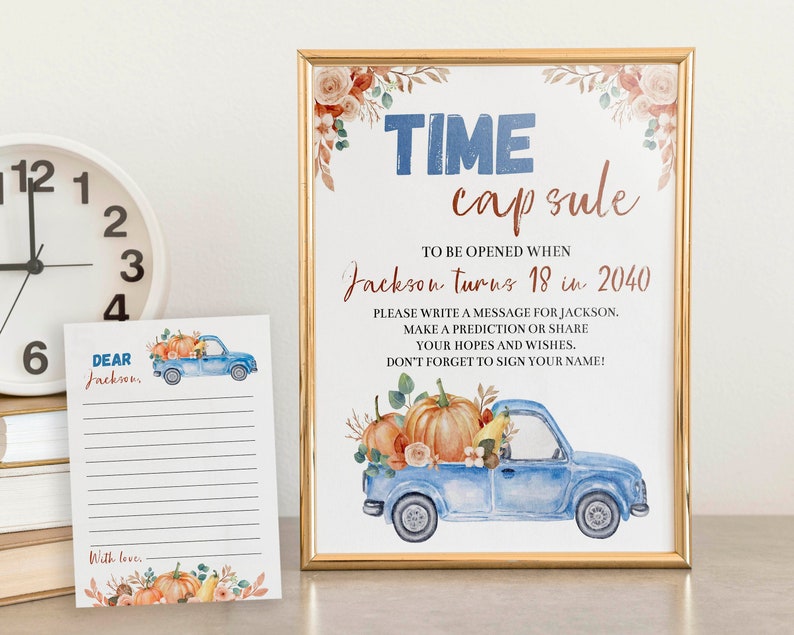 May include: A framed sign and a matching card featuring a watercolor blue truck carrying pumpkins. The sign reads: TIME capsule TO BE OPENED WHEN Jackson turns 18 in 2040. PLEASE WRITE A MESSAGE FOR JACKSON. MAKE A PREDICTION OR SHARE YOUR HOPES AND WISHES.