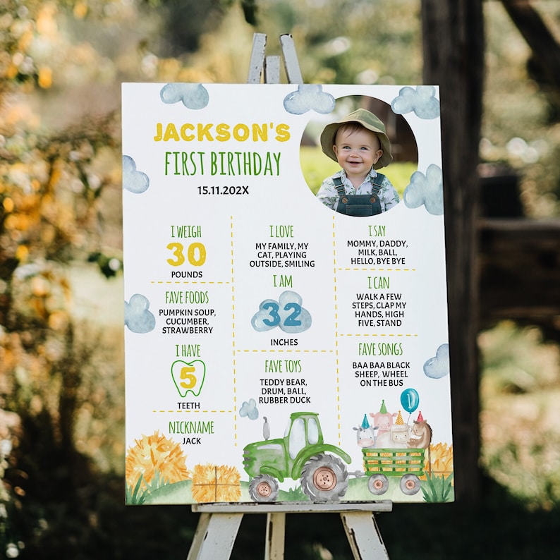 May include: A colorful first birthday milestone poster for a boy named Jackson. The poster features a photo of the child, a tractor, farm animals, and details about his first year, including his weight, height, favorite foods, and songs. The poster is decorated with clouds, stars, and a yellow and green color scheme.