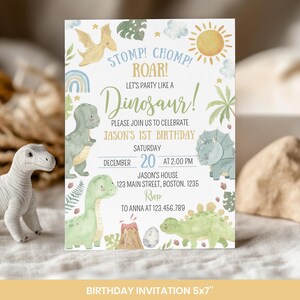 May include: A rectangular birthday invitation card featuring watercolor illustrations of dinosaurs, palm leaves, a sun, and clouds. The text reads: STOMP! CHOMP! ROAR! LET'S PARTY LIKE A DINOSAUR! JASON'S 1ST BIRTHDAY, SATURDAY DECEMBER 20 AT 2:00 PM.