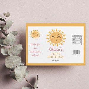 May include: A yellow and white thank you card with a smiling sun illustration. The text reads "Thank you for celebrating with me! Olivia's First Birthday 15.04.20XX".